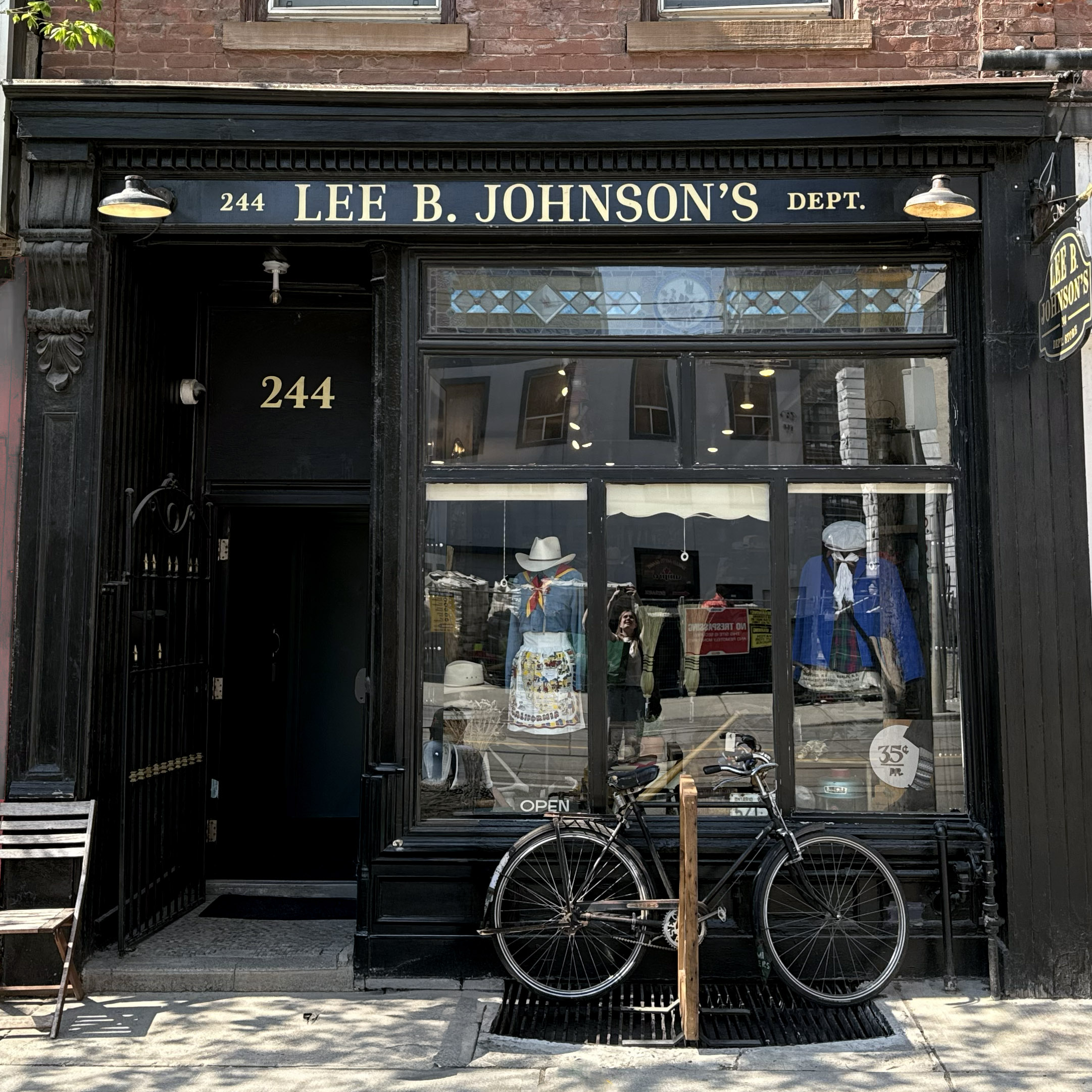 Lee B Johnson's Dept Store at 244 Queen St E, full storefront with hand-painted black and gold signage