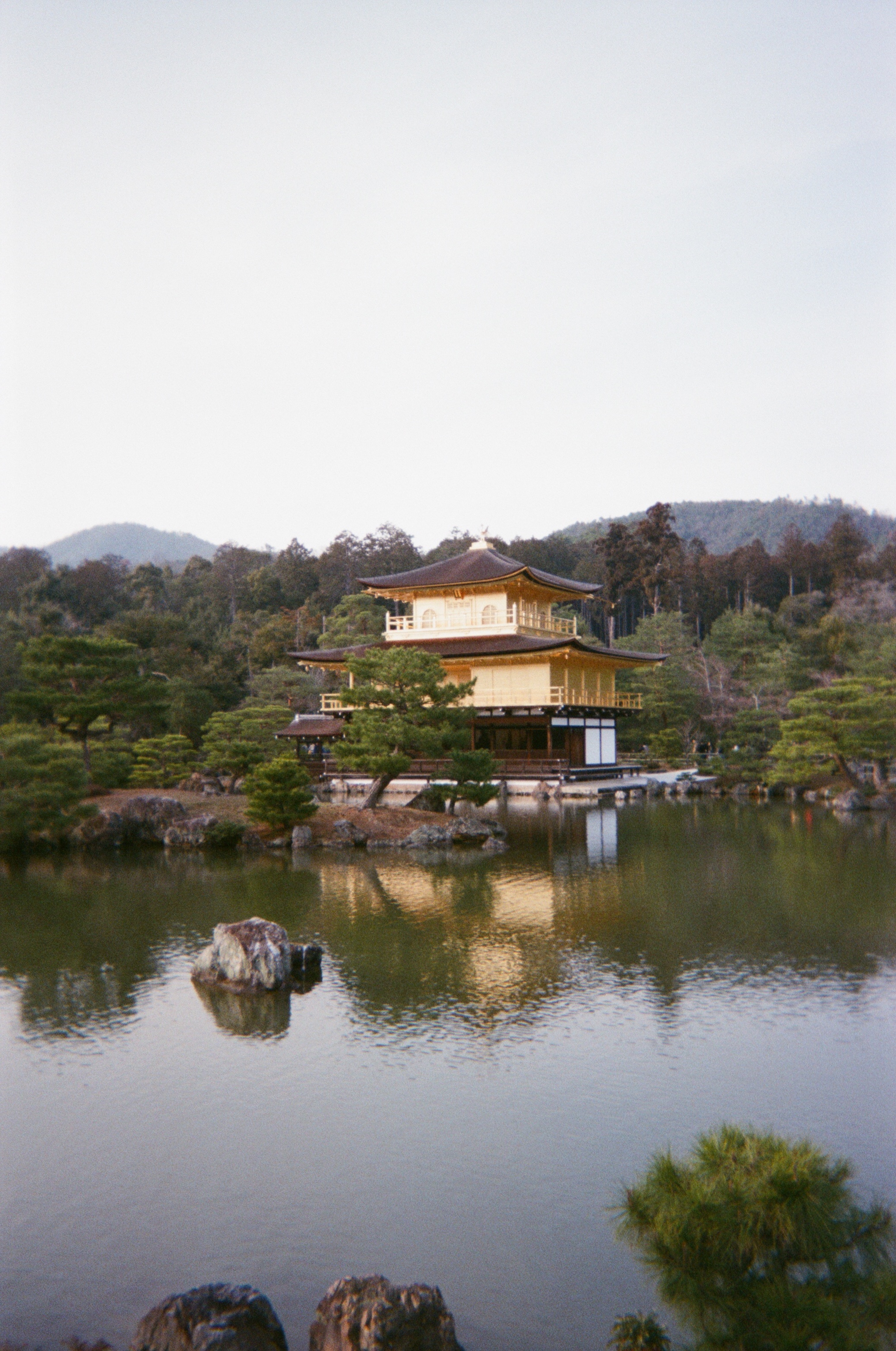 Kinkaku-ji, the Golden Pavilion in Kyoto, reflected in still pond water